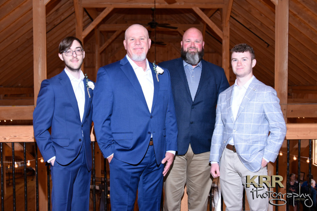 A picture of the groom with groomsmen at the barn at Pleasant Acres