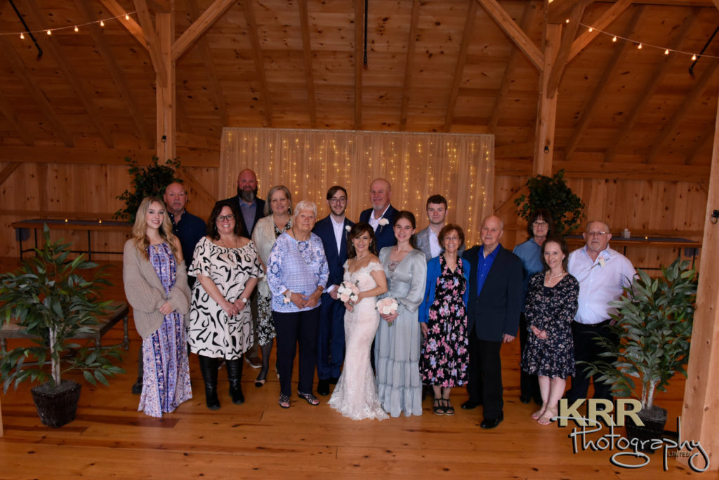 A group shot of a wedding party at the Barn at Pleasant Acres